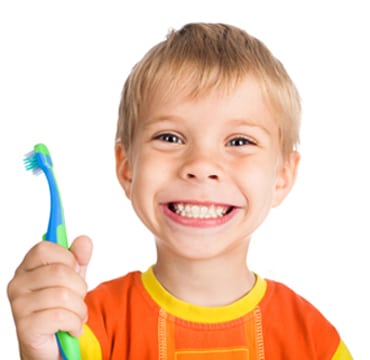 Head-and-shoulders photo of a young blonde boy wearing an orange shirt, trimmed in yellow and holding a bright blue and green toothbrush in his right hand; for information on Hoffman Estates pediatric dentistry from Dr. Becker.